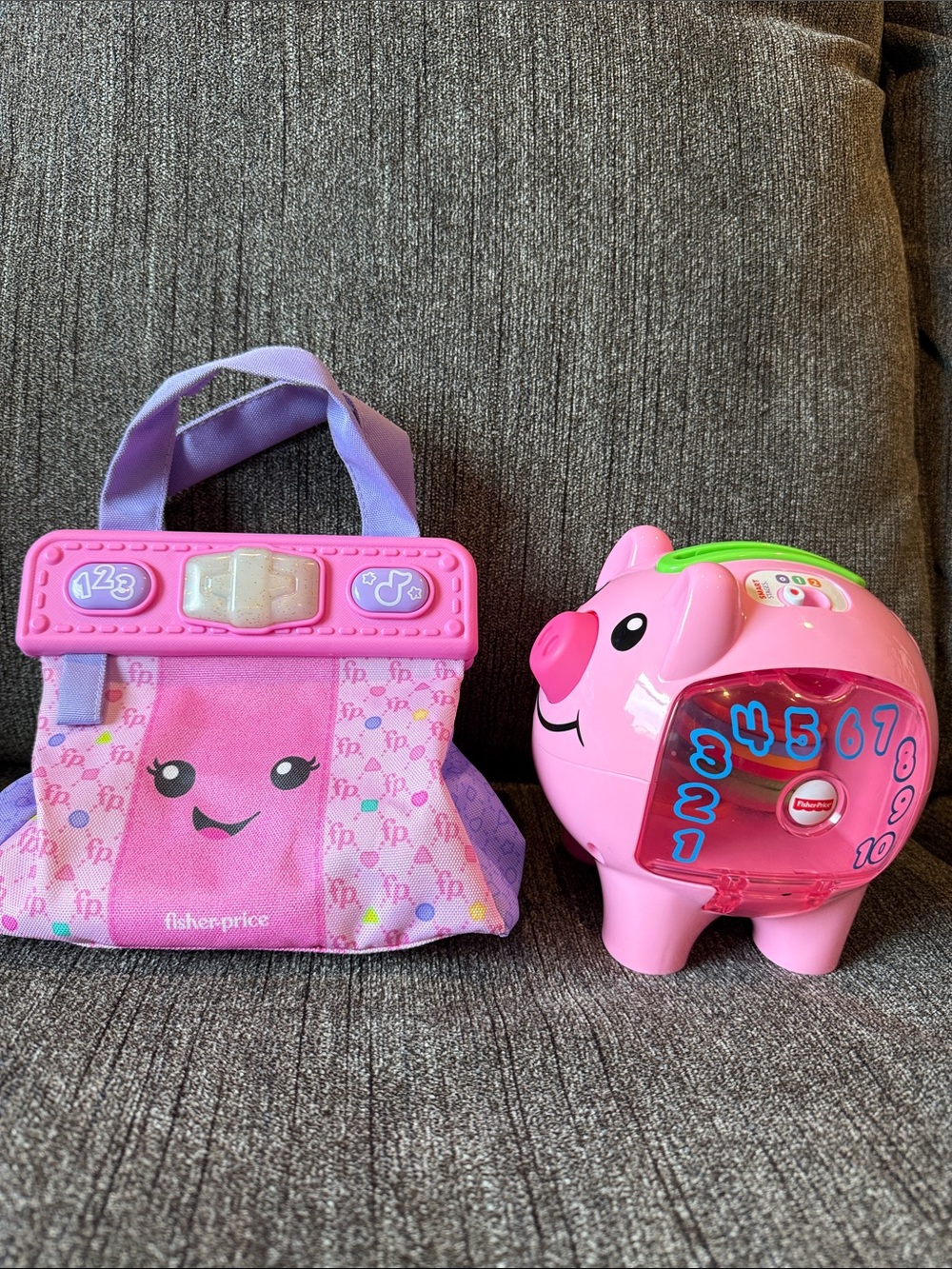 LOT OF TWO FISHER PRICE TODDLERS TOYS. LIGHT UP PURSE AND PIGGY BANK
